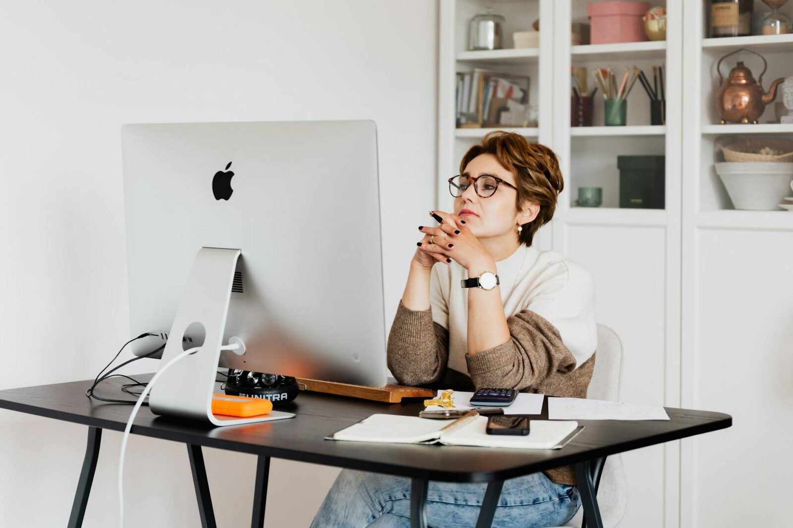 focused female employee reading information on computer in office Small is Big: The Best Small Wins to Boost Your Career Earnings Today