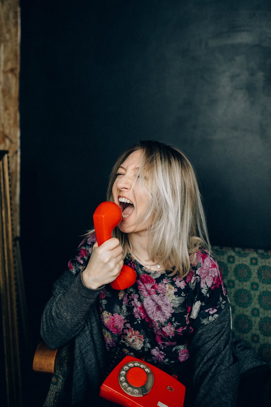 woman shouting on a phone How to Find Your Voice