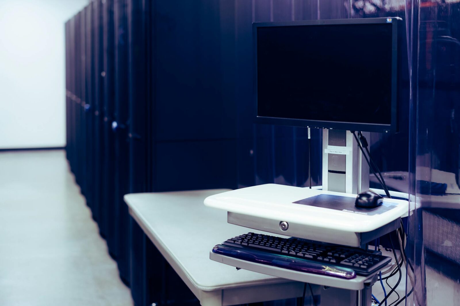 modern computer placed near server racks 5+ Top Data Centers Supporting Houston’s Small Business Growth