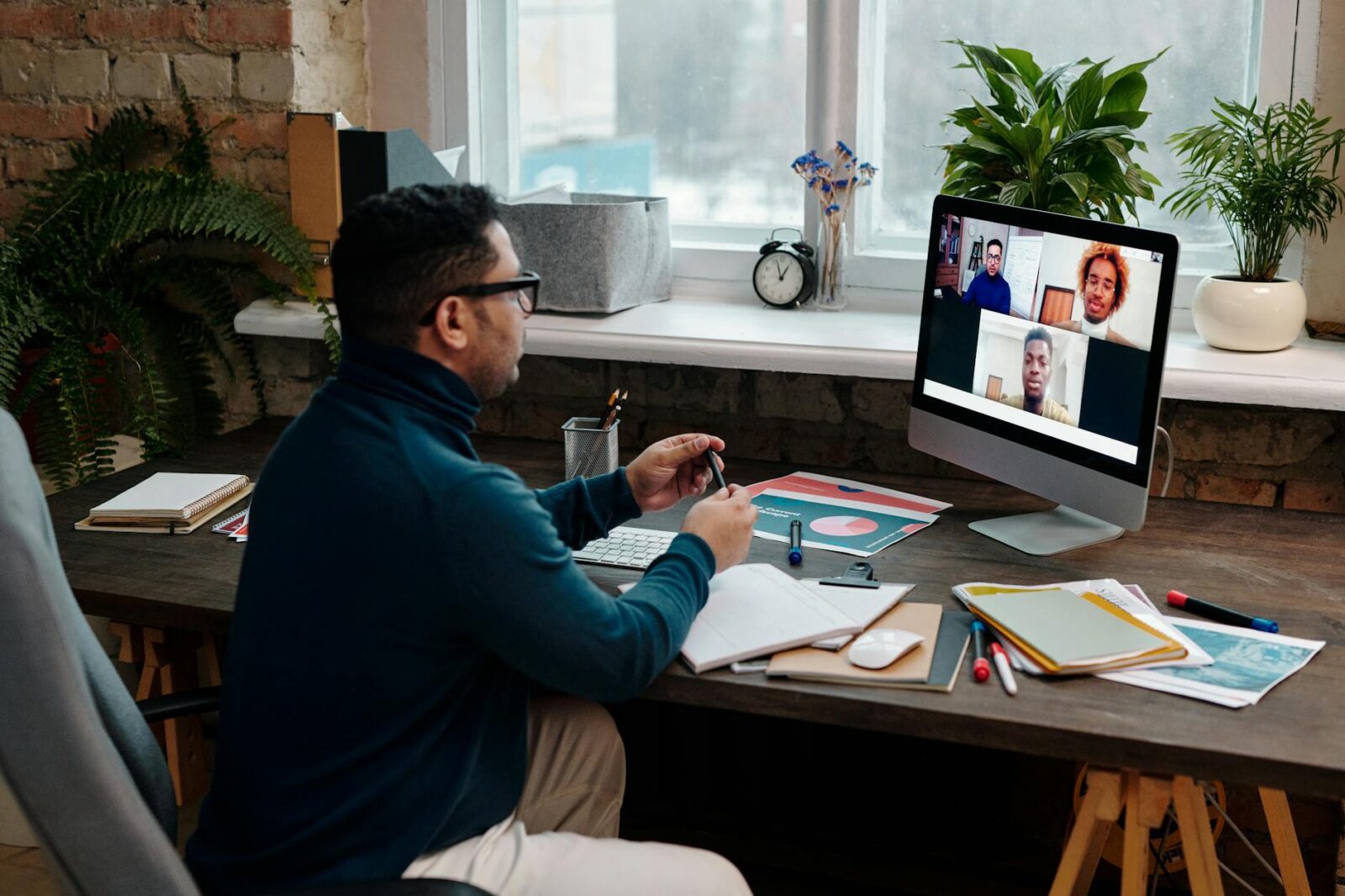 teacher video calling with his students using a computer Why Virtual Meetings Are a Game-Changer for Real Estate Efficiency