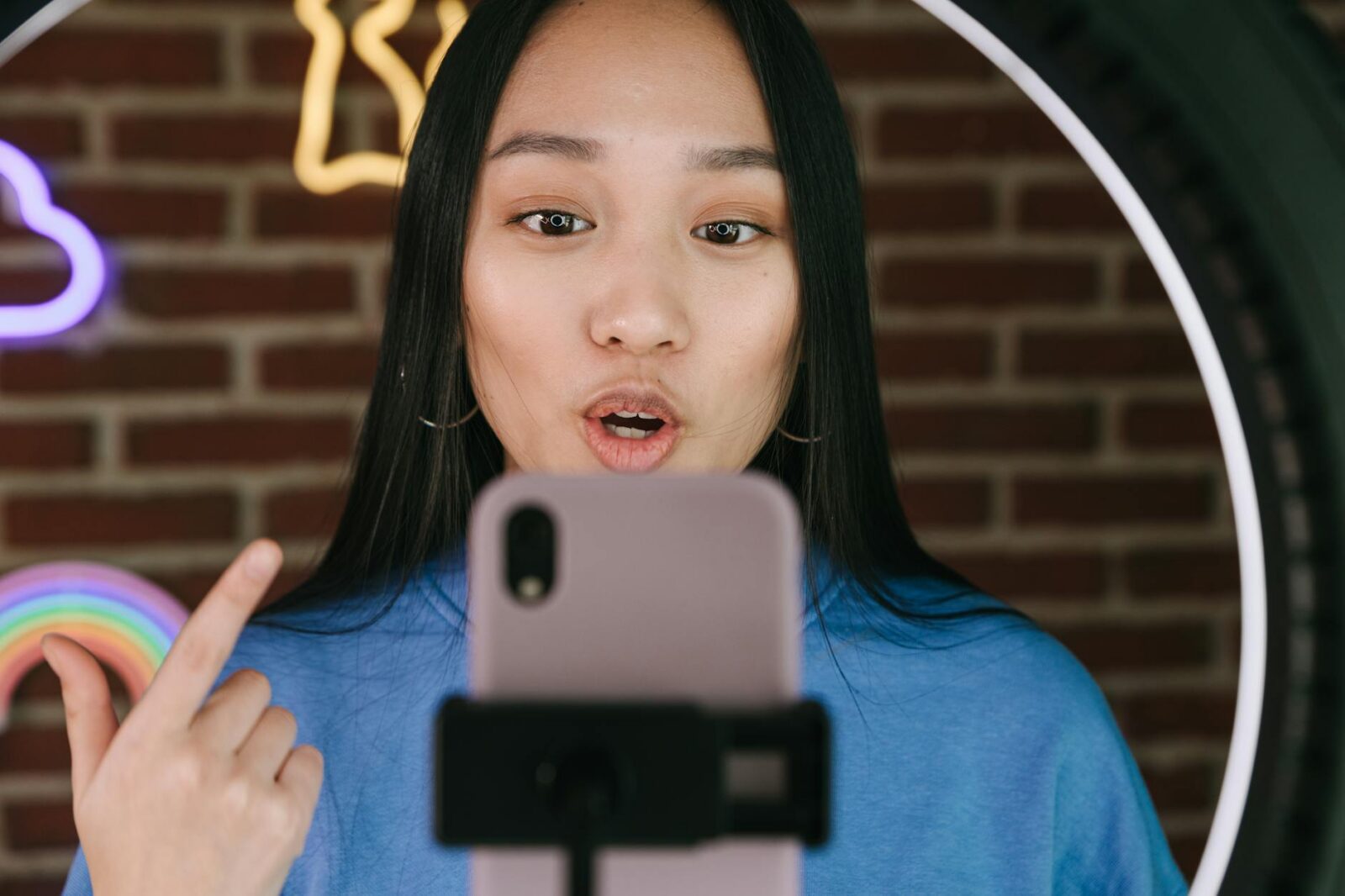 a woman recording herself with a smartphone Small is Big: The Best Small Wins to Boost Your Career Earnings Today