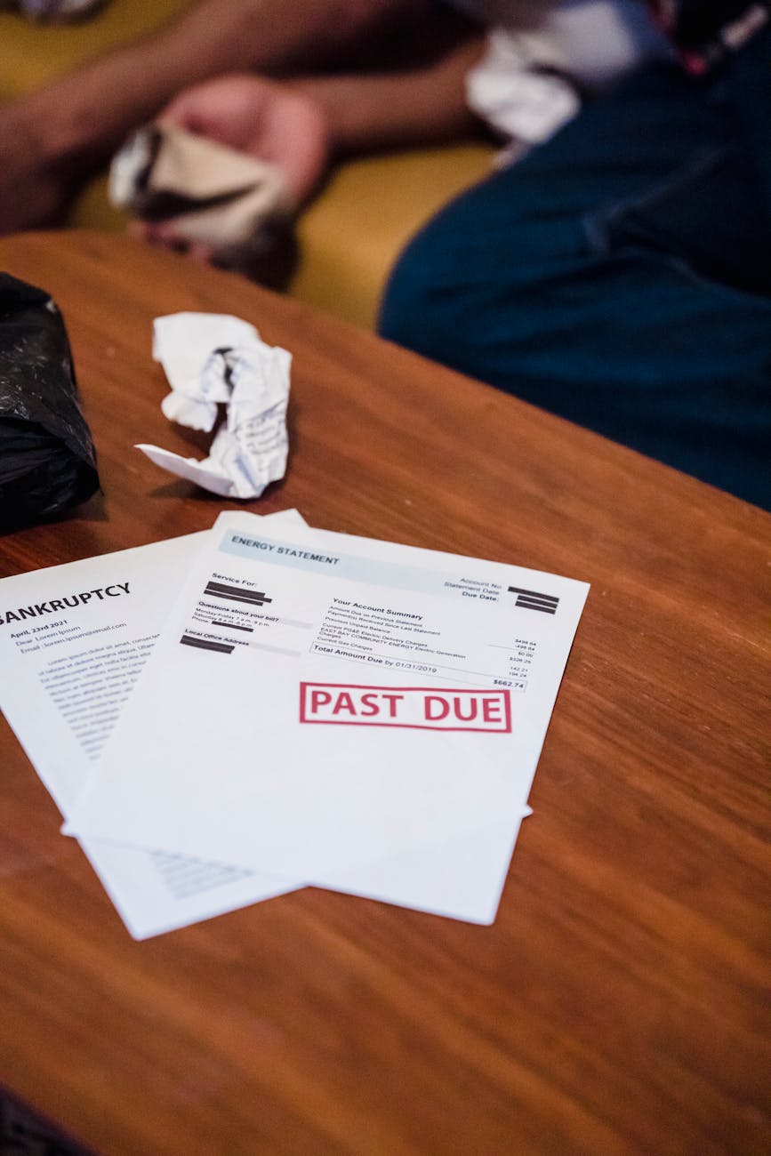 documents on table Overwhelmed By Debt? Here's How to Get Through It
