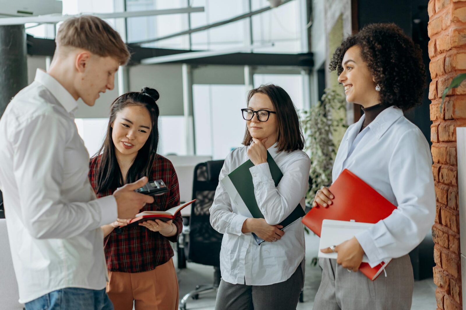 photograph of coworkers talking The Unexpected Skills That Can Increase Your Career Confidence