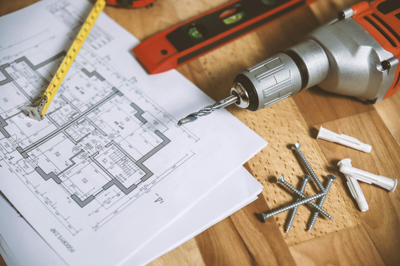 floor plan on table The Biggest Renovation Mistakes People Are Still Making in 2025