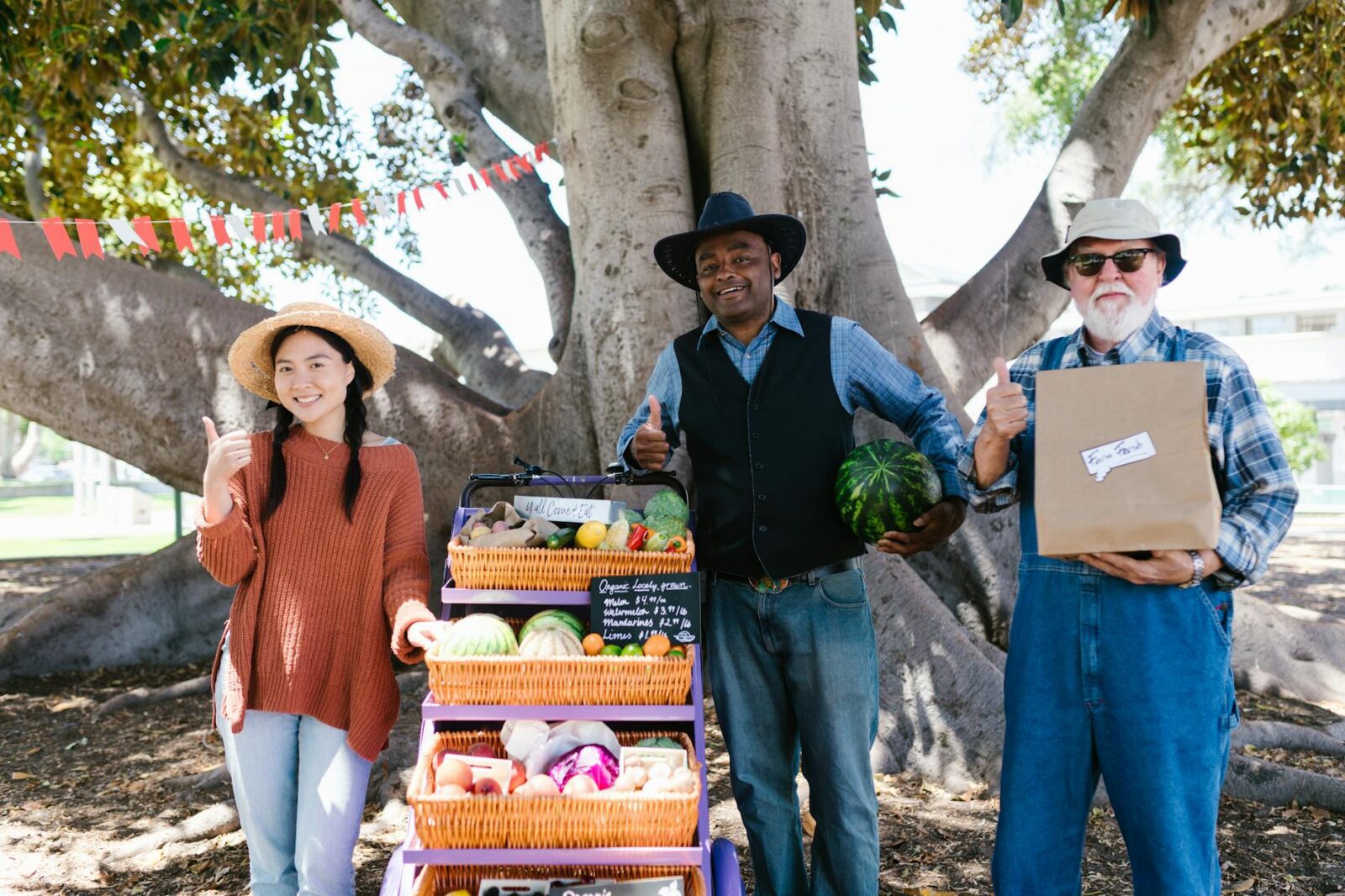 a group of people standing near the cart with woven baskets
