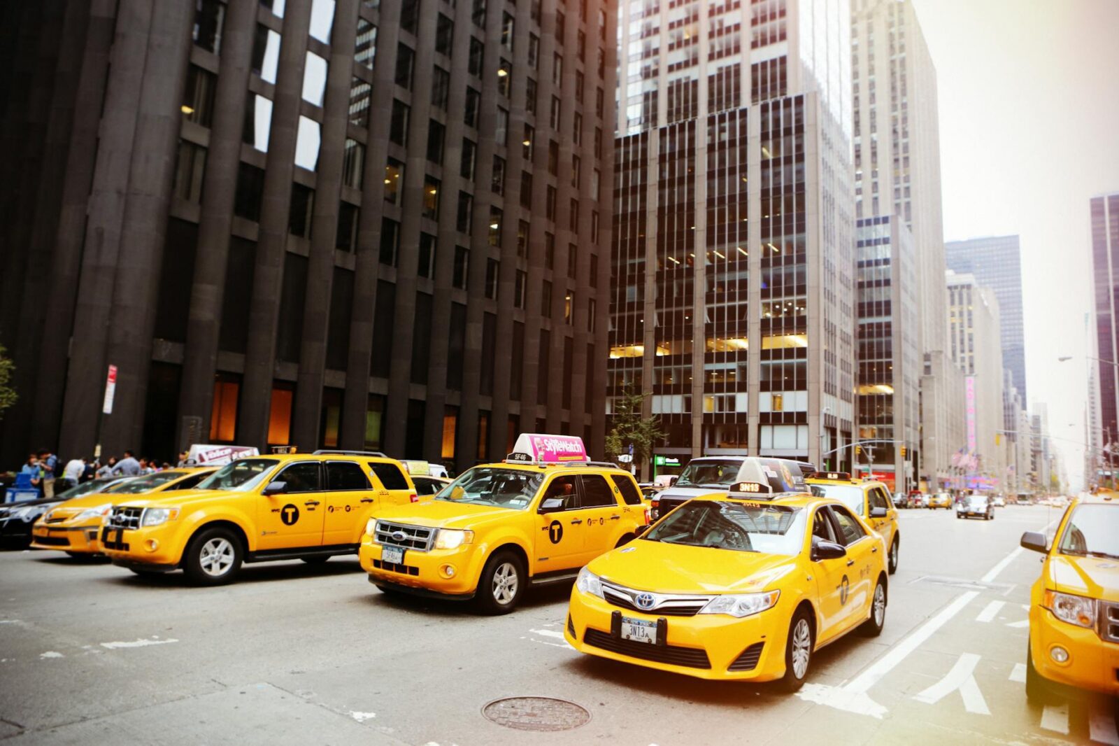 yellow vehicles at the street Smart Spending: How To Cut Costs Without Sacrificing Quality