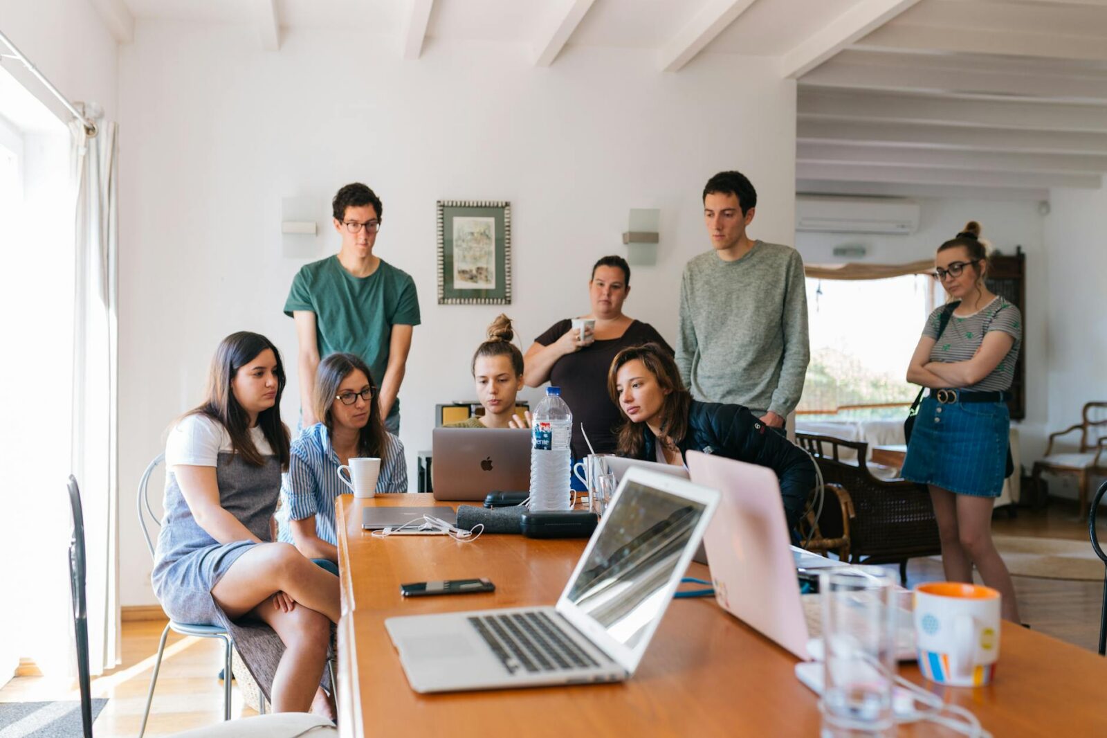 group of people watching on laptop How to Improve Team Skills with Learning Opportunities Outside the Office
