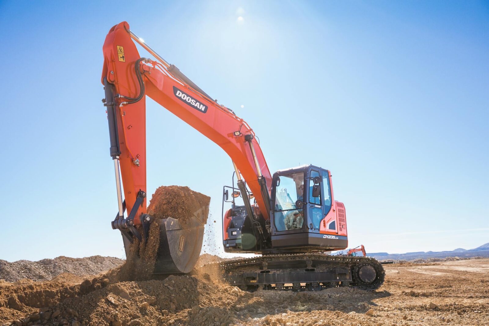 crawler excavator digging in a quary How to Become a Successful Real Estate Developer: 11 Essential Steps