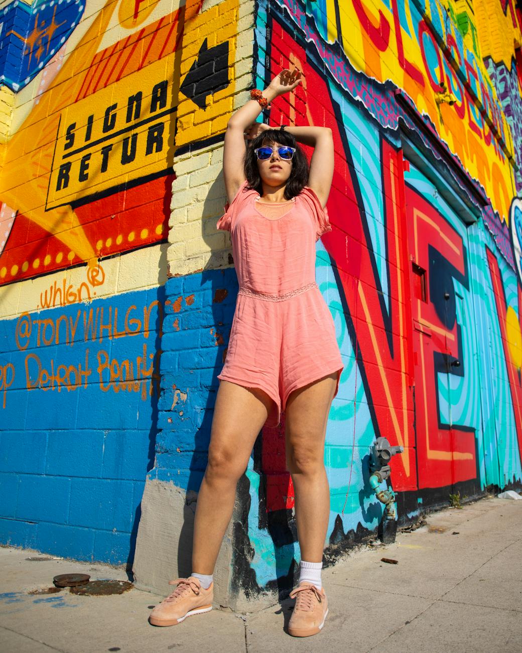 photo of woman wearing pink jumpsuit Moving to Michigan: Migration Trends and Top Destinations