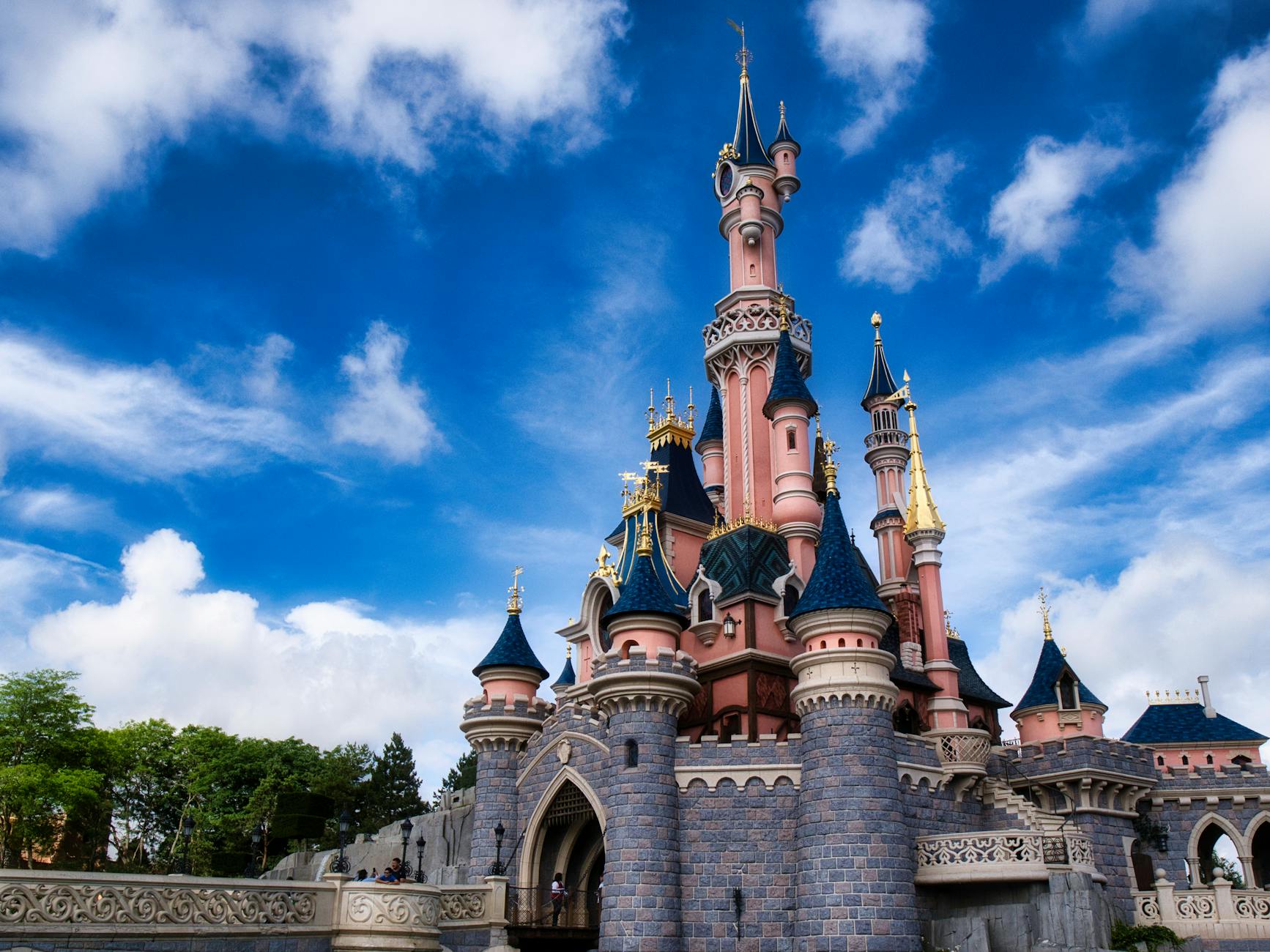 enchanting disneyland paris castle under blue sky 7 Fun Family Vacation Ideas Your Kids Will Love