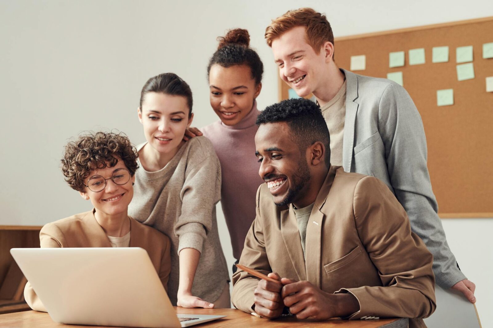 photo of people looking on laptop Are You Struggling With Your Business? How to Fix It and Grow Stronger