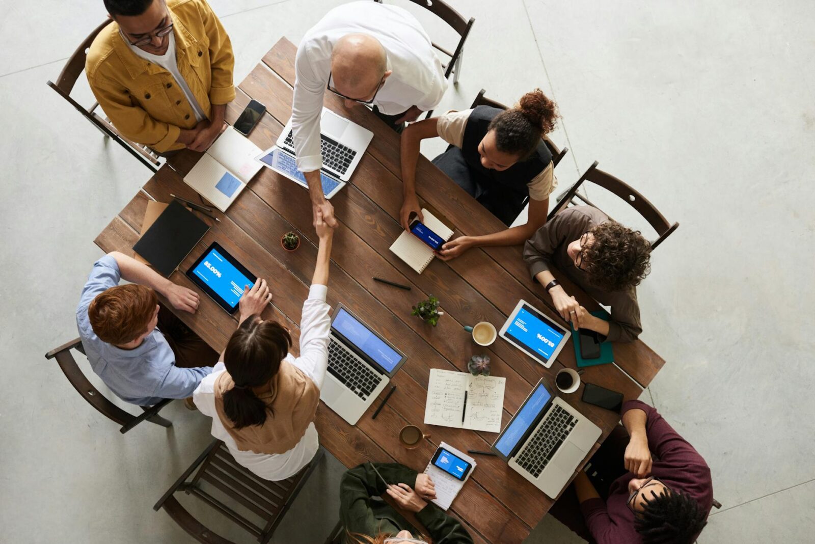 photo of people doing handshakes Boost Office Efficiency: Uncover Hidden Workflow Bottlenecks