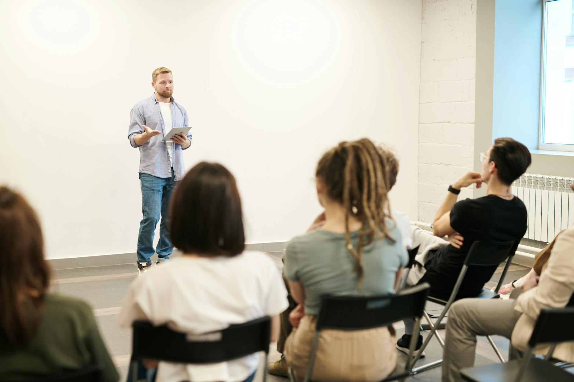 man wearing gray dress shirt and blue jeans Planning a Career Change: Key Steps for a Smooth Transition
