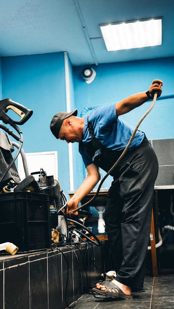 technician repairing industrial equipment in workshop Why Having the Right Support Makes Workplace Recovery Easier