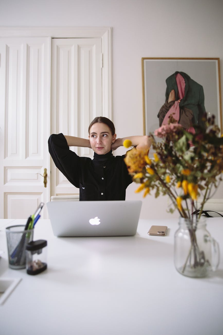 woman sitting in front of laptop Planning a Career Change: Key Steps for a Smooth Transition