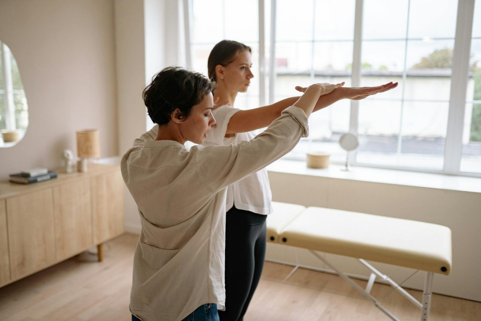 a therapist assisting a client