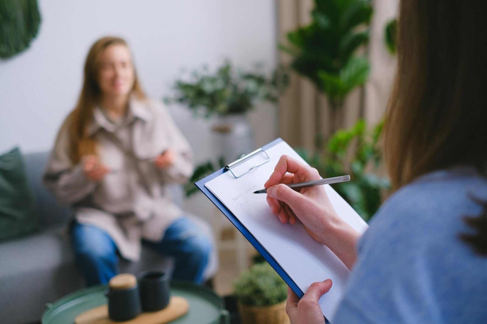 crop psychologist taking notes during appointment What to Do If You're Injured Through No Fault of Your Own