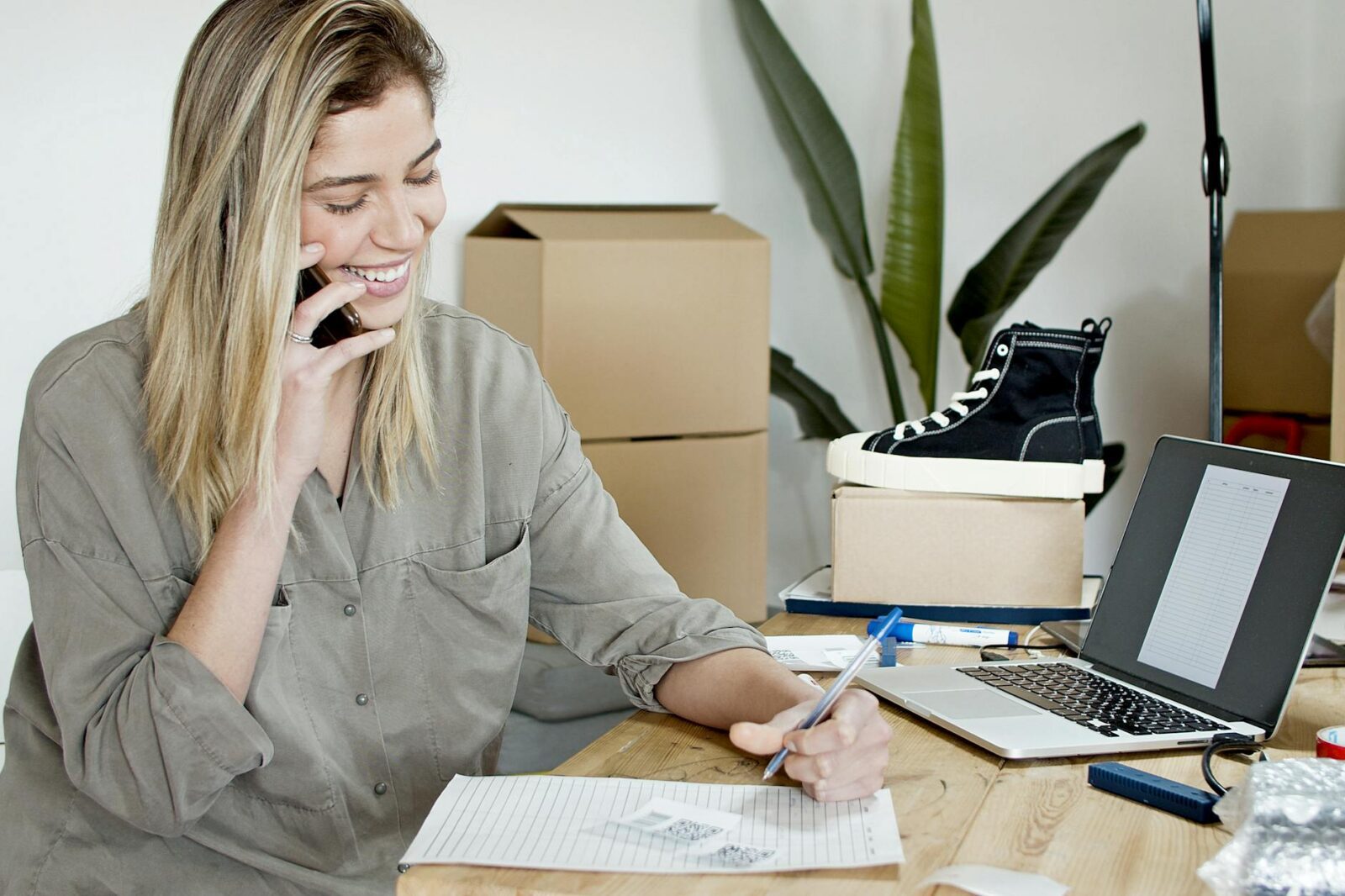 woman taking orders by phone Quick Startup Guide to Selling Products Online