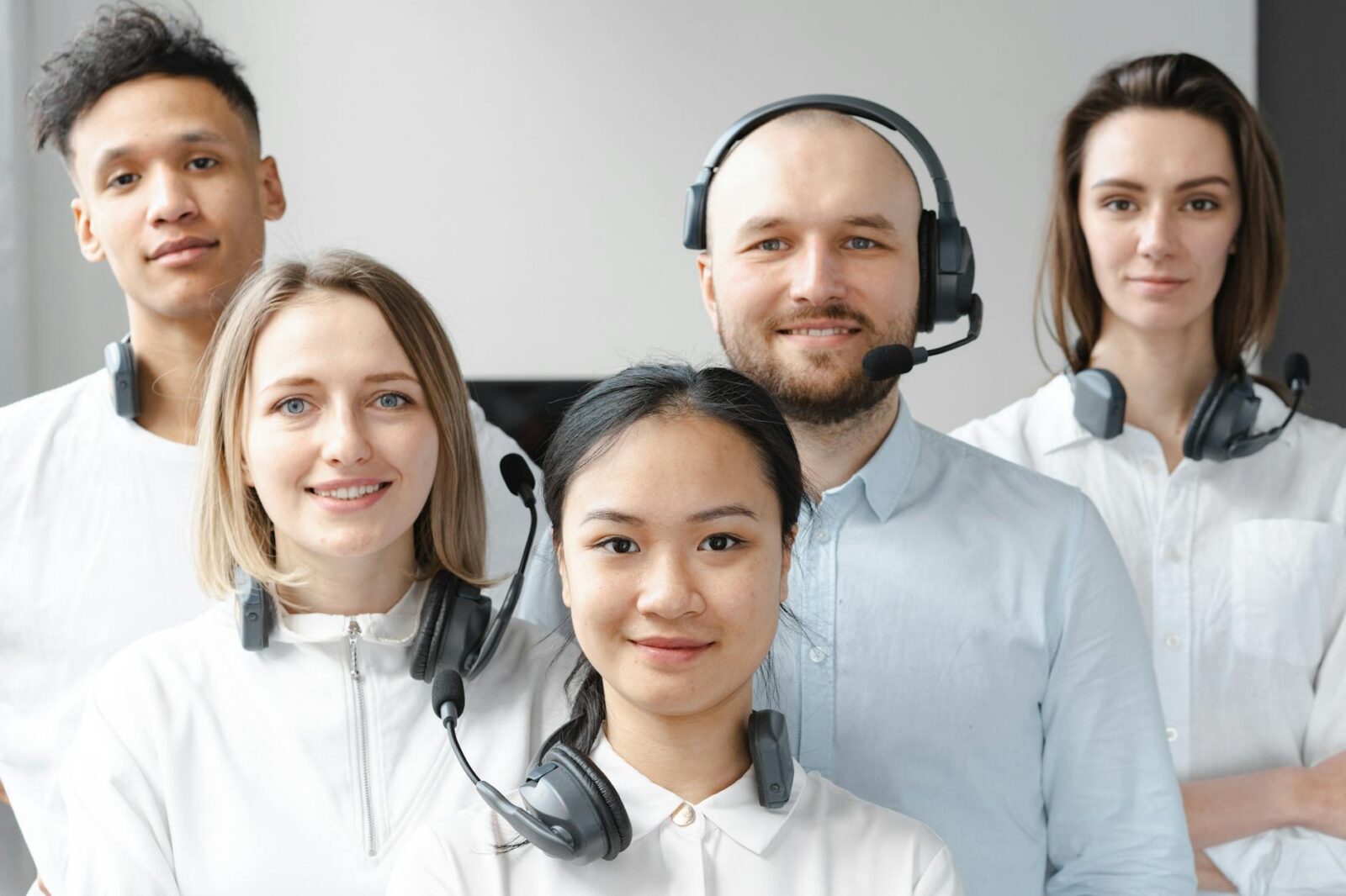 smiling call center agents looking at camera What Top Amazon Sellers Do Differently to Dominate the Marketplace