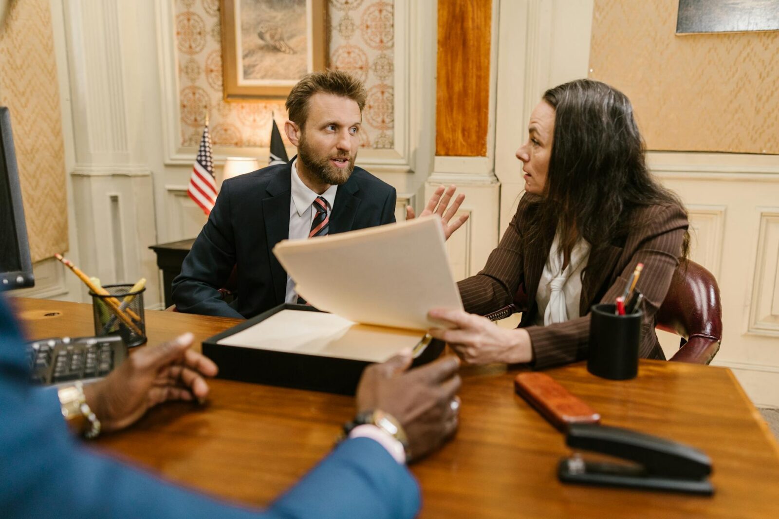 a lawyer and client talking together Top Reasons to Pursue a Legal Career: Growth, Prestige, and Opportunity