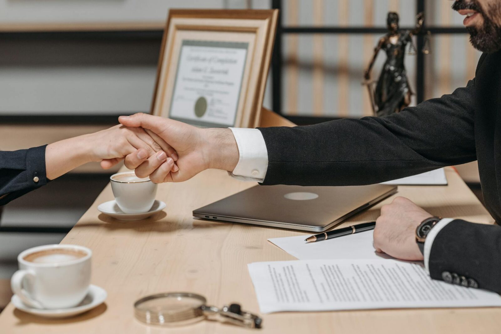 people shaking their hands in close deal business contract What to Do If You're Injured Through No Fault of Your Own