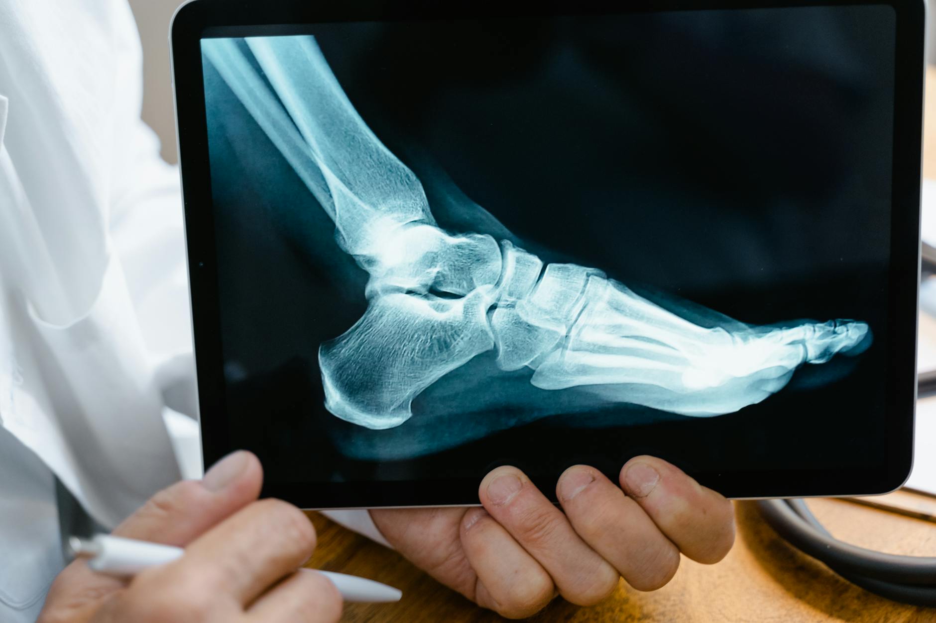 person holding black tablet computer Why Having the Right Support Makes Workplace Recovery Easier