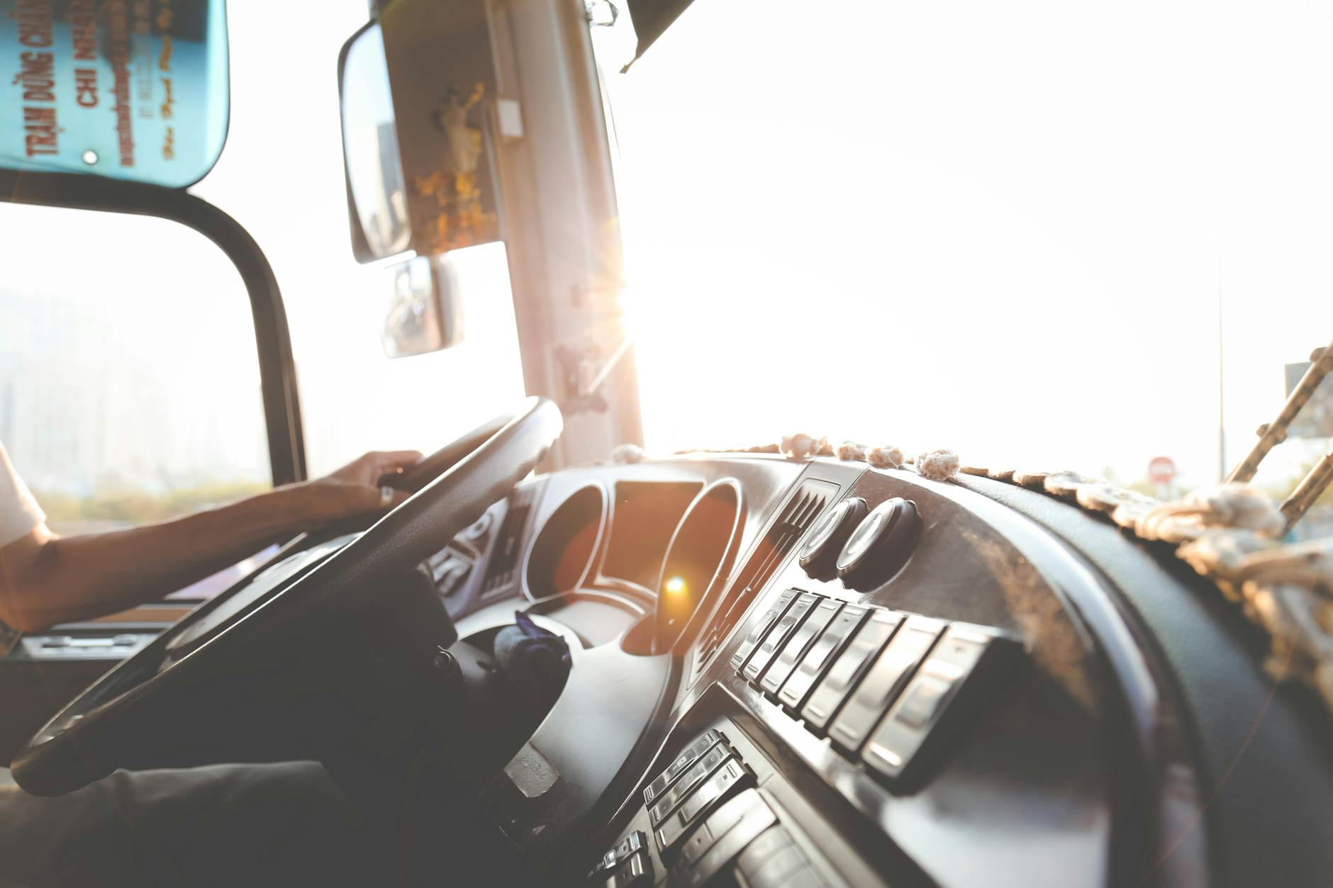 person hand on steering wheel Are You Cut Out to be a Truck Driver? A Realistic Look at the Career