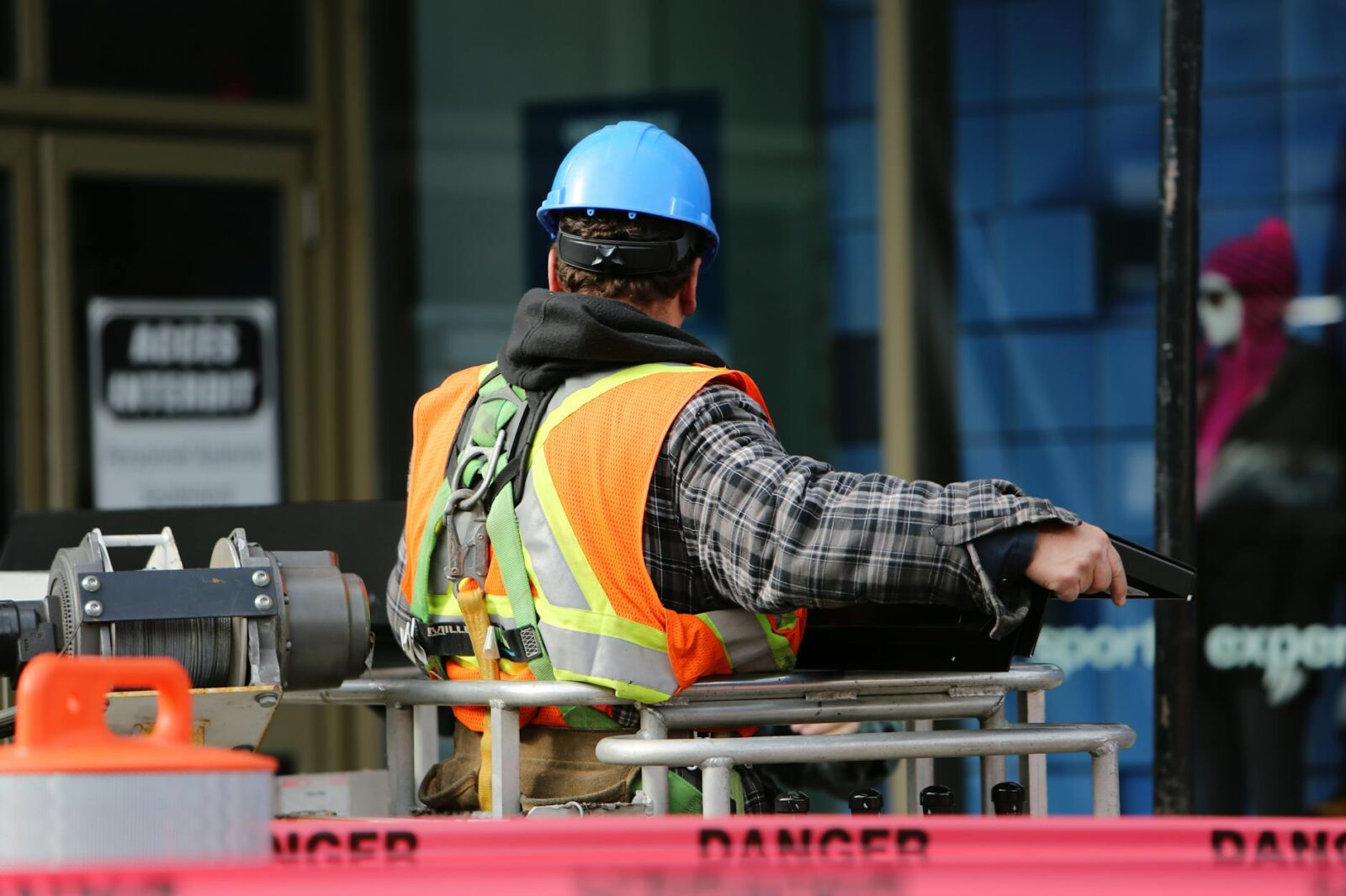 man wearing hard hat standing The Role of Workplace Safety in Driving Business Success