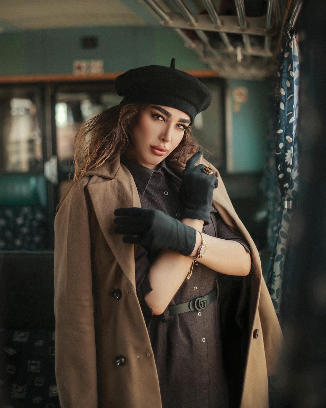 woman posing in coat and hat Elevate Your Escape: Plan a Luxury Travel Experience