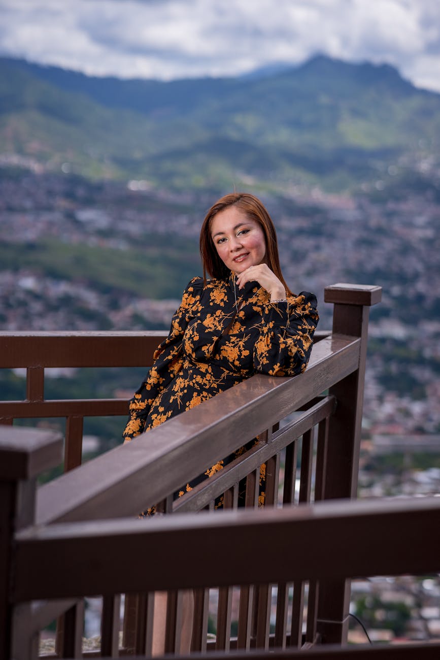 a woman in dress leaning on the railings Why Honduras Property Investment Is a Smart Choice for Your Real Estate Portfolio