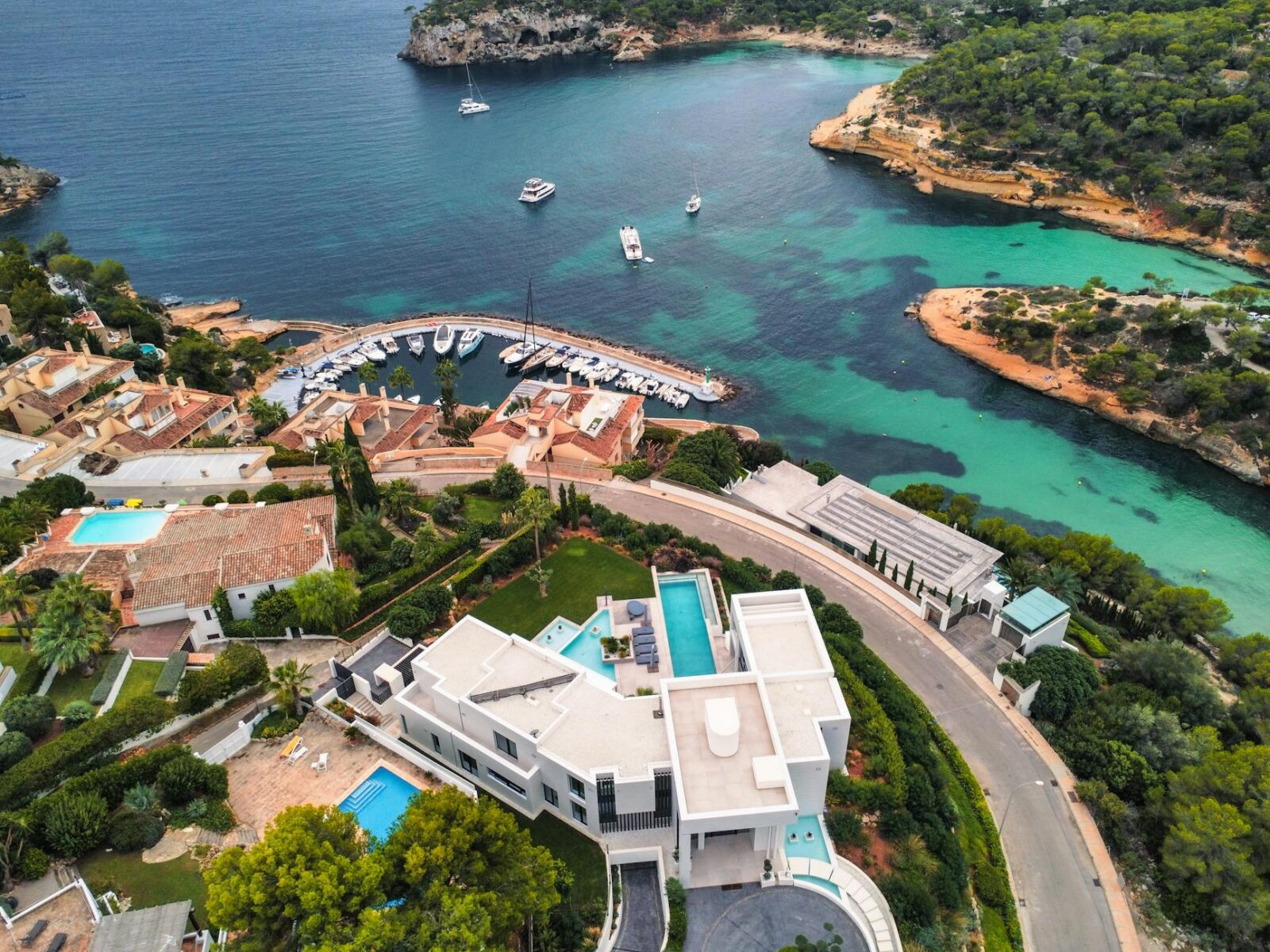 Your Ultimate Guide to Buying a Luxury Home 8 aerial view of luxurious coastline villas and marina Your Ultimate Guide to Buying a Luxury Home