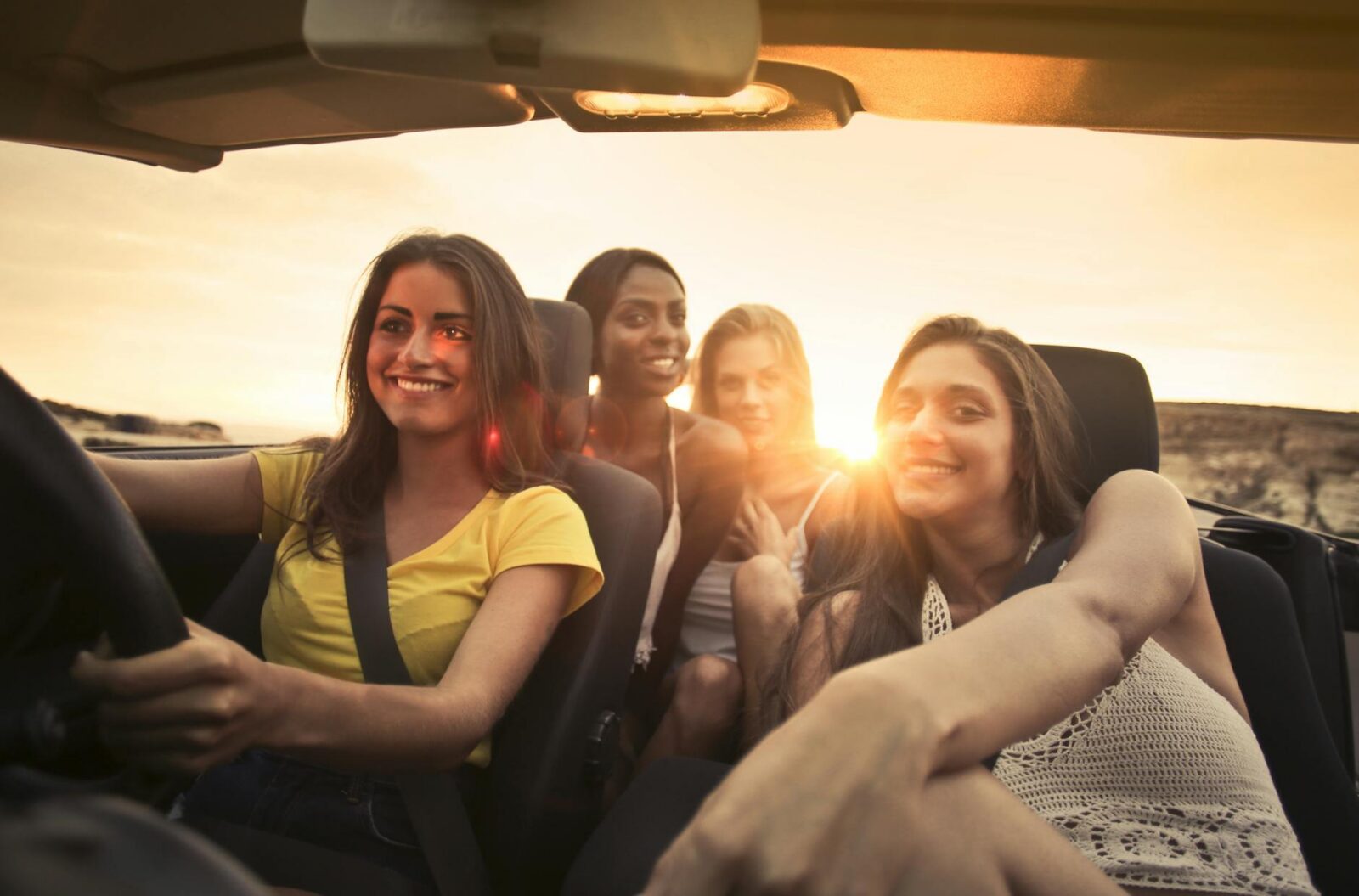 Road Trip Packing: What Every Woman Should Bring for Comfort + Safety 11 photo of women sitting on car Road Trip Packing: What Every Woman Should Bring for Comfort + Safety