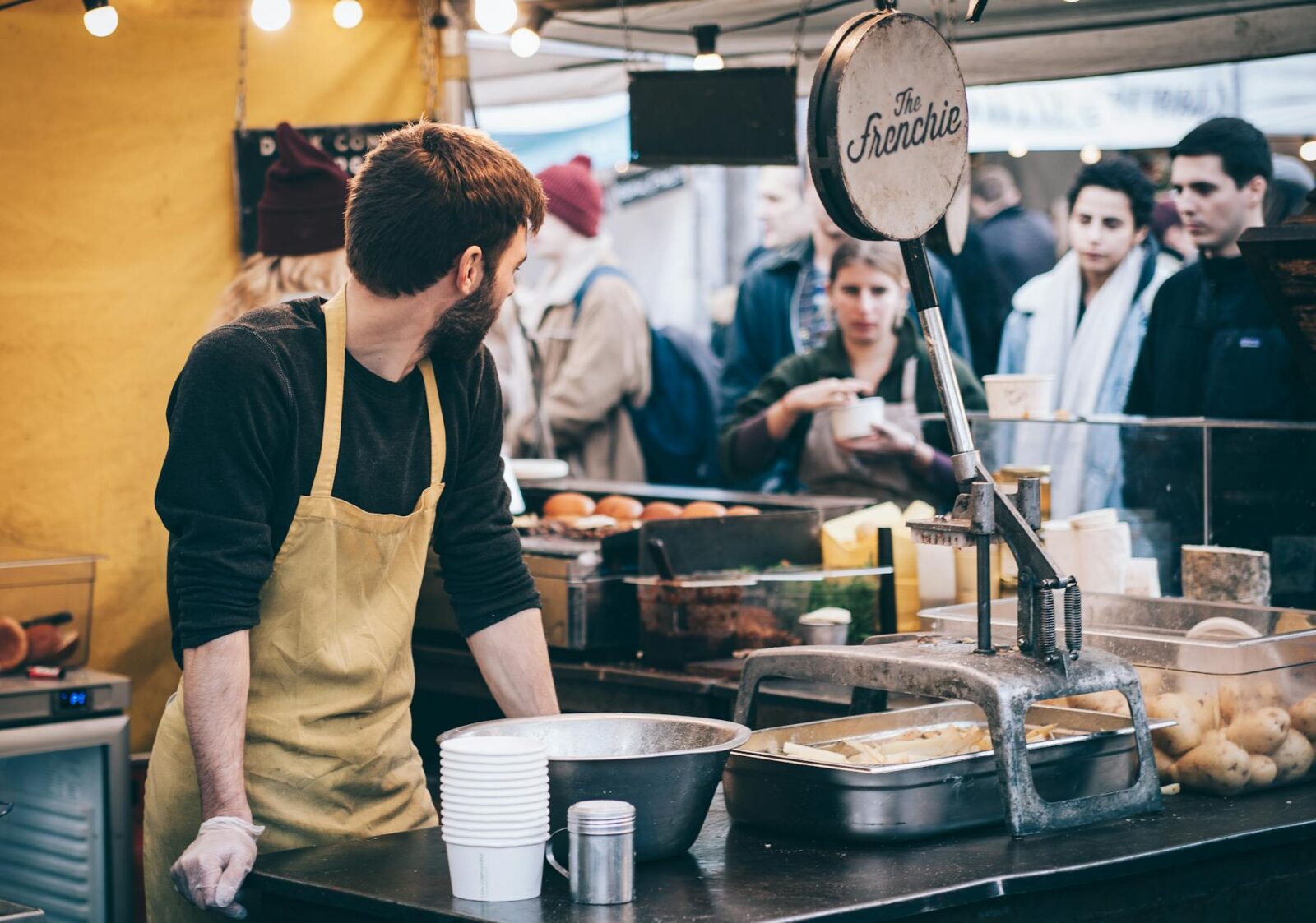 man standing in front of bowl and looking towards left Small Business Solutions That Can Save Your Company Thousands