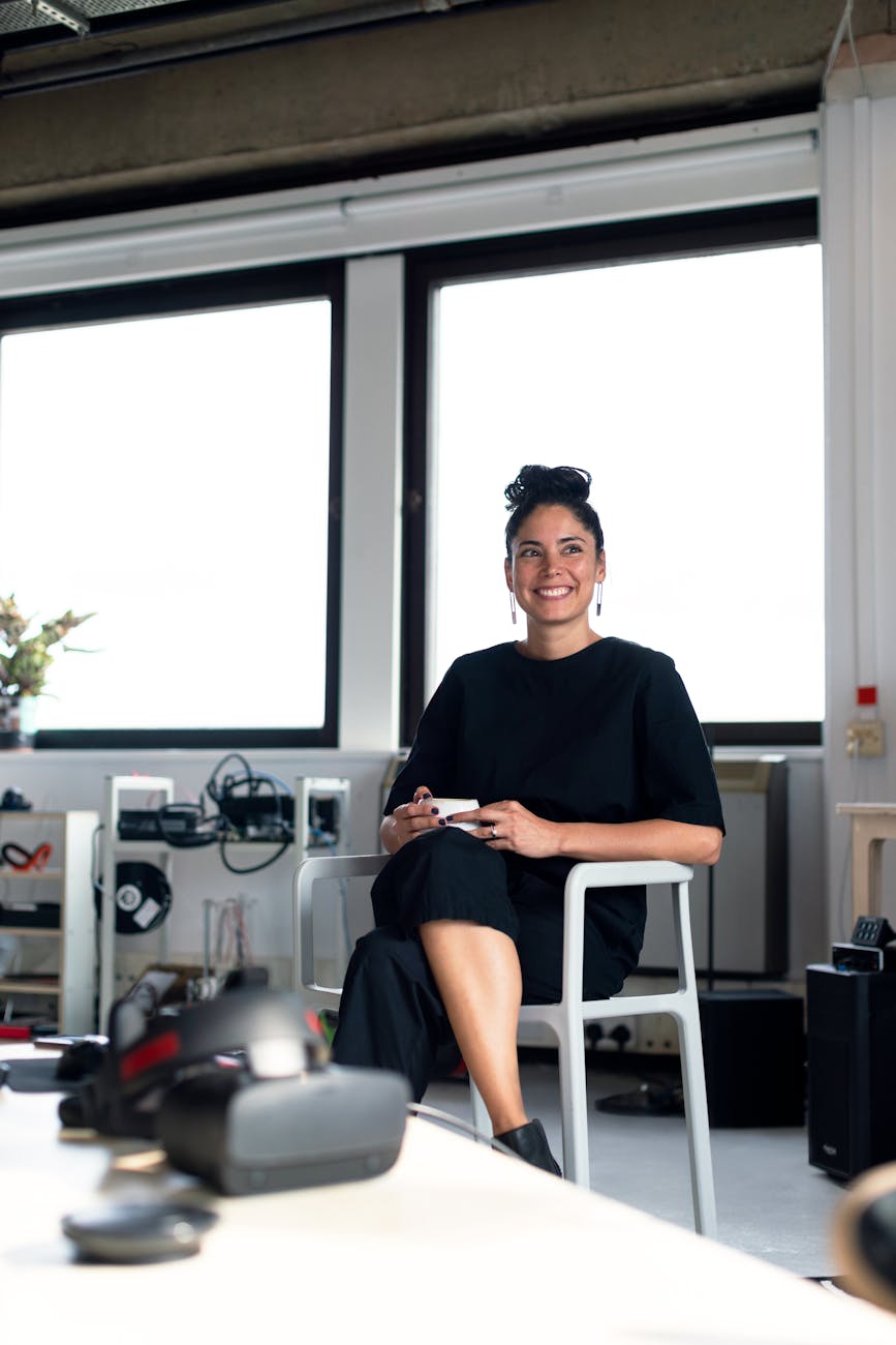 portrait of woman sitting on chair Entrepreneurship 101: How To Make Running A Business Feel Less Stressful