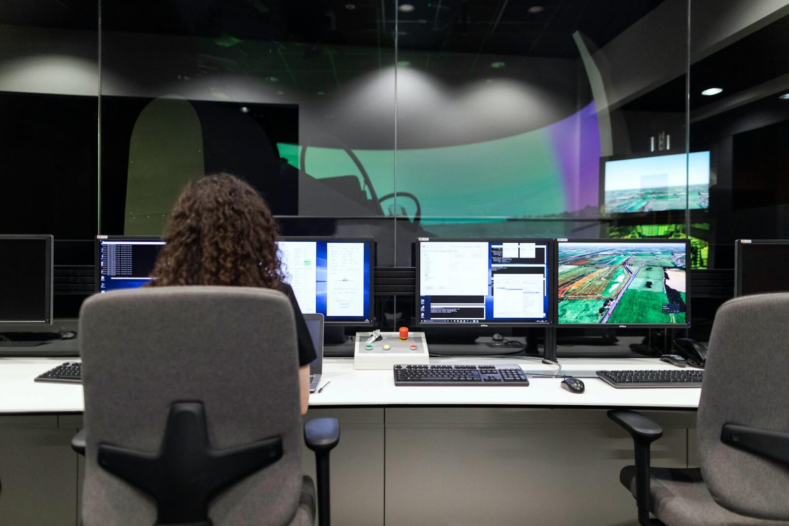 female engineer controlling flight simulator Small Business Solutions That Can Save Your Company Thousands