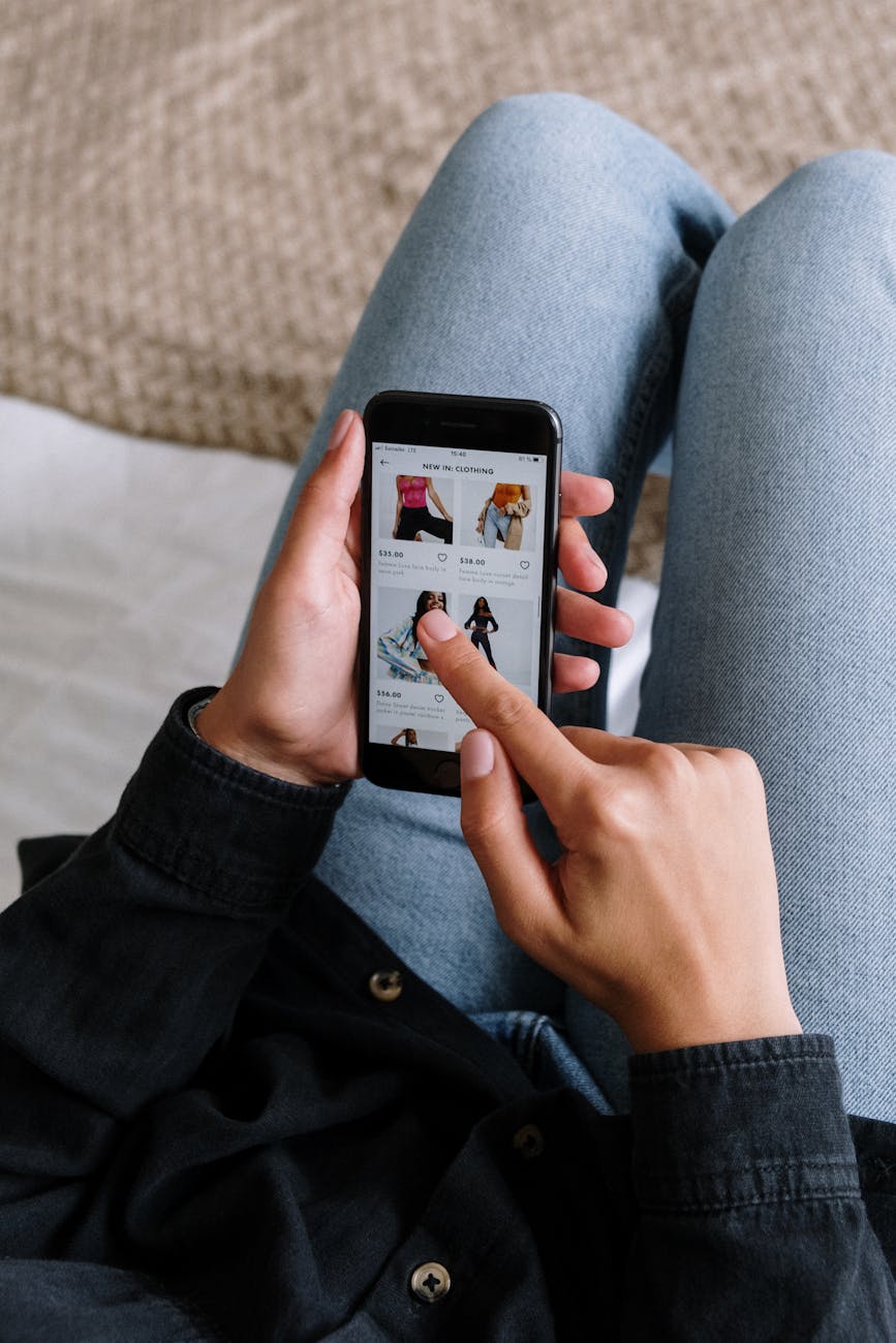 person holding black android smartphone 3 Reasons Why FOMO Is The Best Marketing Tactic