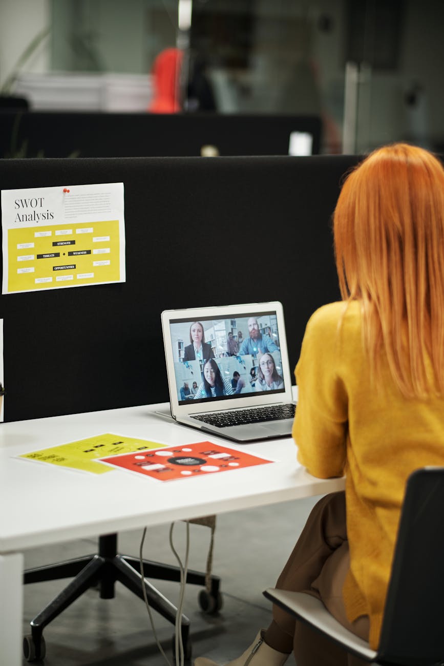 a woman in a video call 7 Practical Tips to Run and Grow Your Business Long-Term