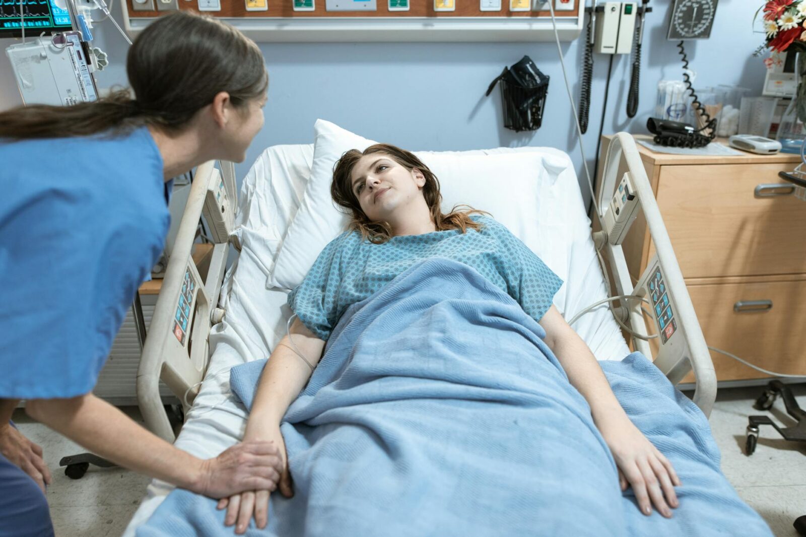 a woman talking to a patient How to Build Trust as a Healthcare Business Owner
