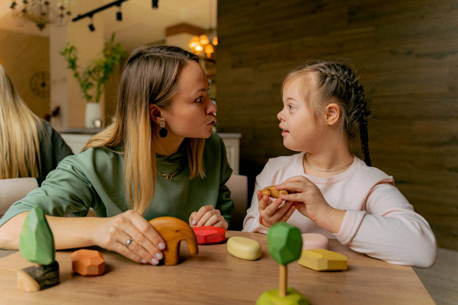 a woman and girl playing together 12 Essential Life Skills to Teach Your Kids (Beyond School Lessons)