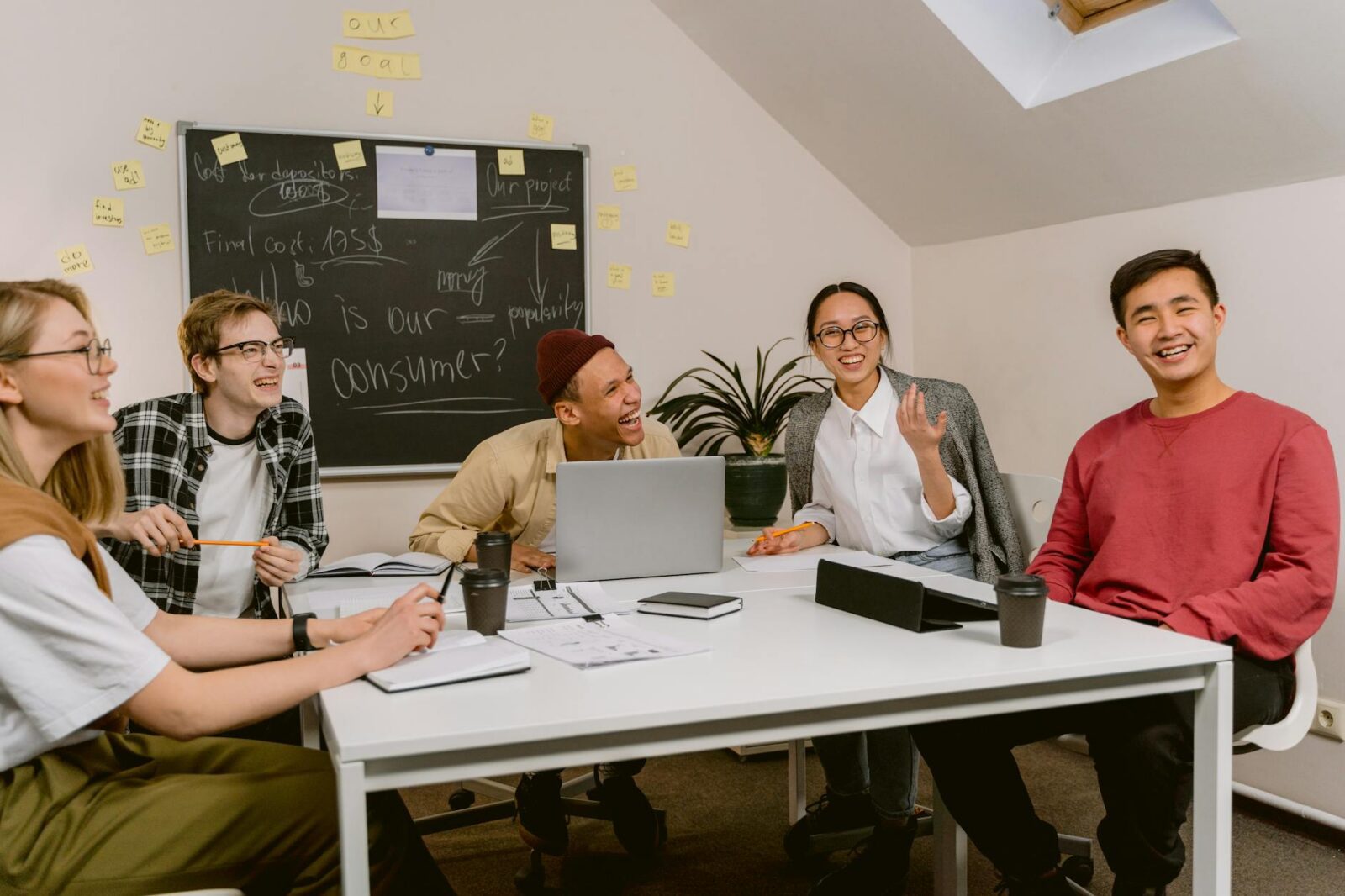 people laughing while in a meeting 7 Practical Tips to Run and Grow Your Business Long-Term