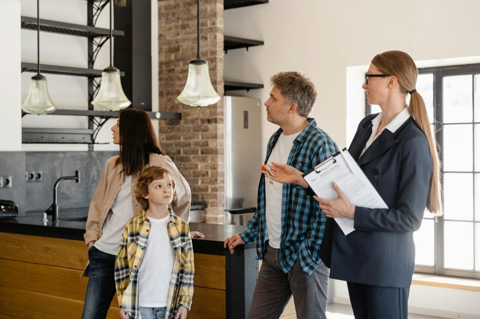 a family moving checking the house The Family Guide to Moving During Big Life Changes