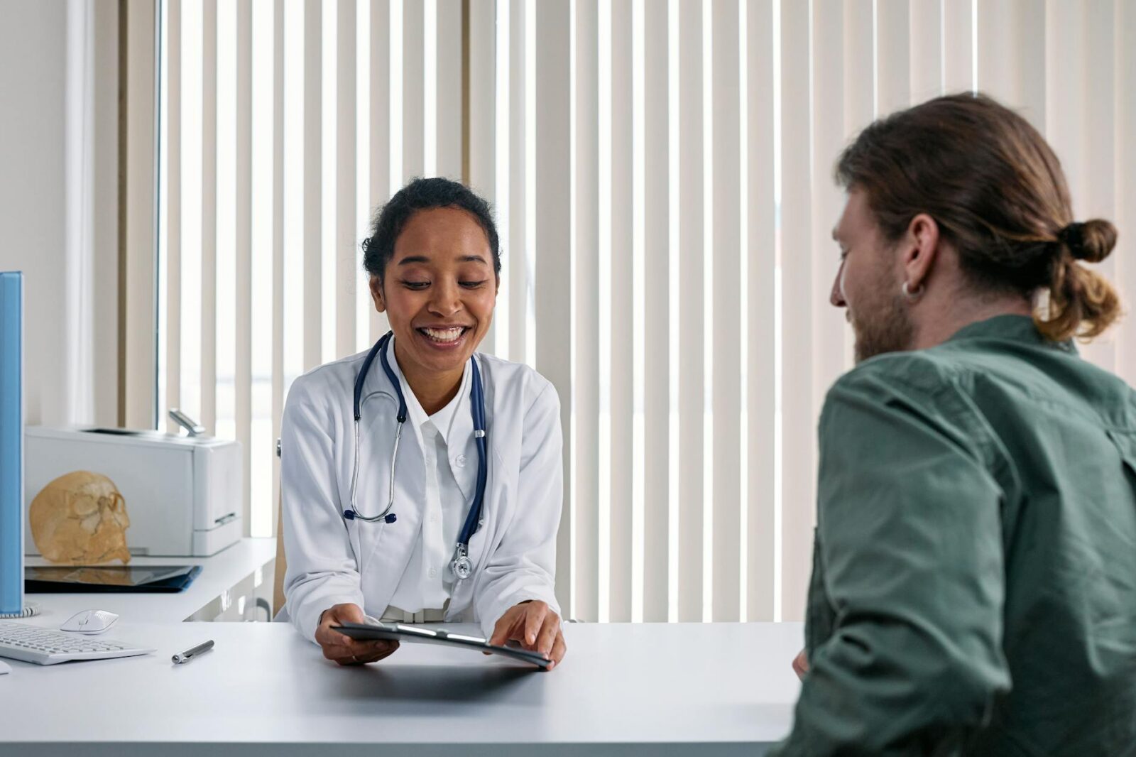 a doctor talking the patient How to Build Trust as a Healthcare Business Owner