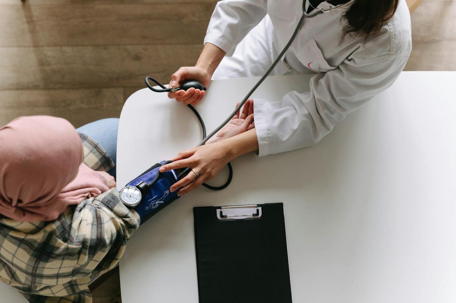 a doctor taking patient s blood pressure What to Do After a Car Accident: Step-by-Step Checklist