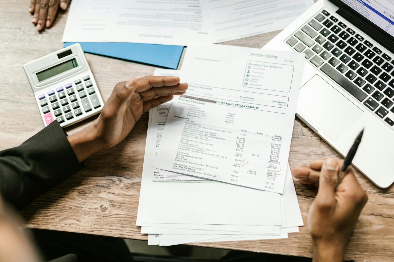 white papers on the table Cash Offers Explained: Are iBuyers and Investors Right for You?