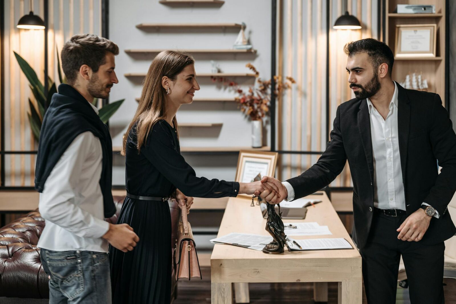 man and woman shaking hands What to Do After a Car Accident: Step-by-Step Checklist