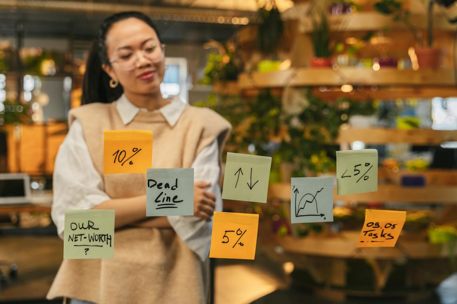 woman looking at sticky notes What To Do When Inheriting A Large Sum Of Money
