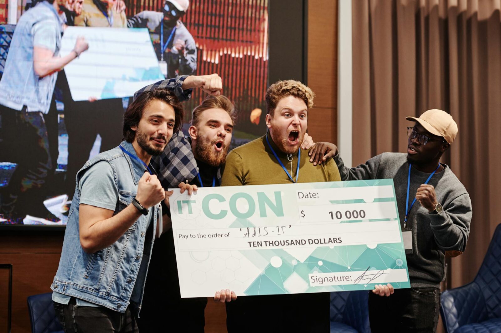 men smiling at the camera