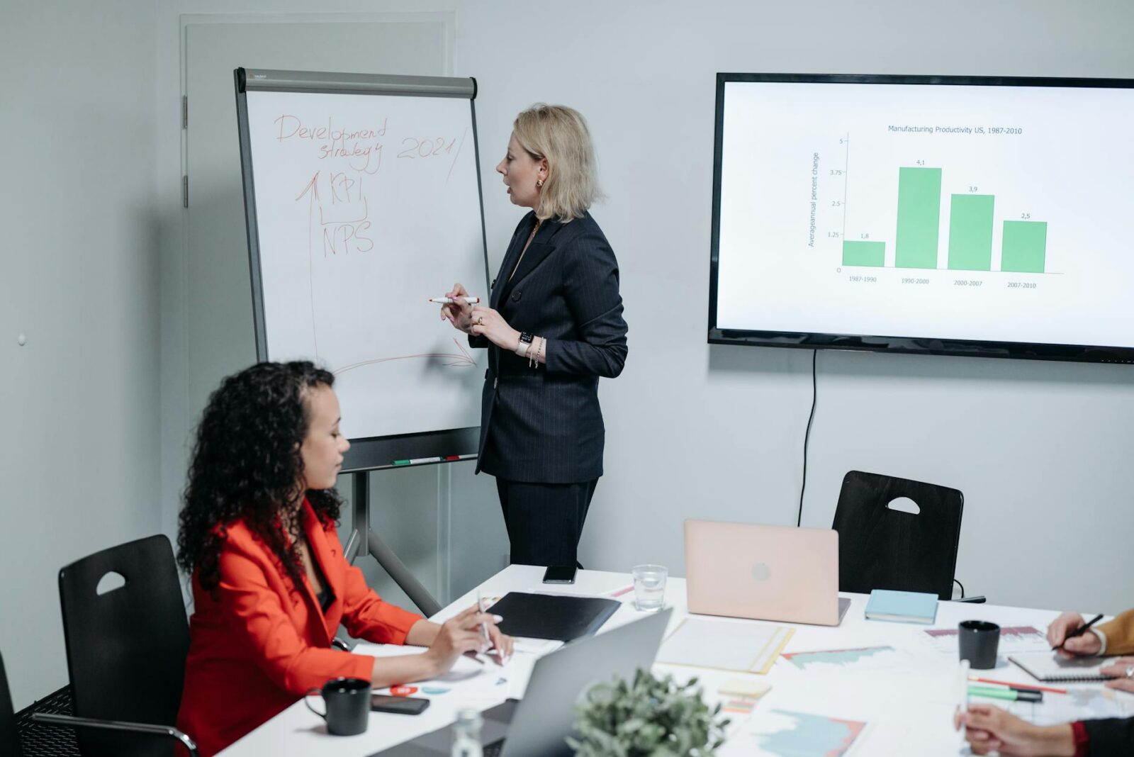woman in suit discussing at work The Business Hacks Every Entrepreneur Overlooks
