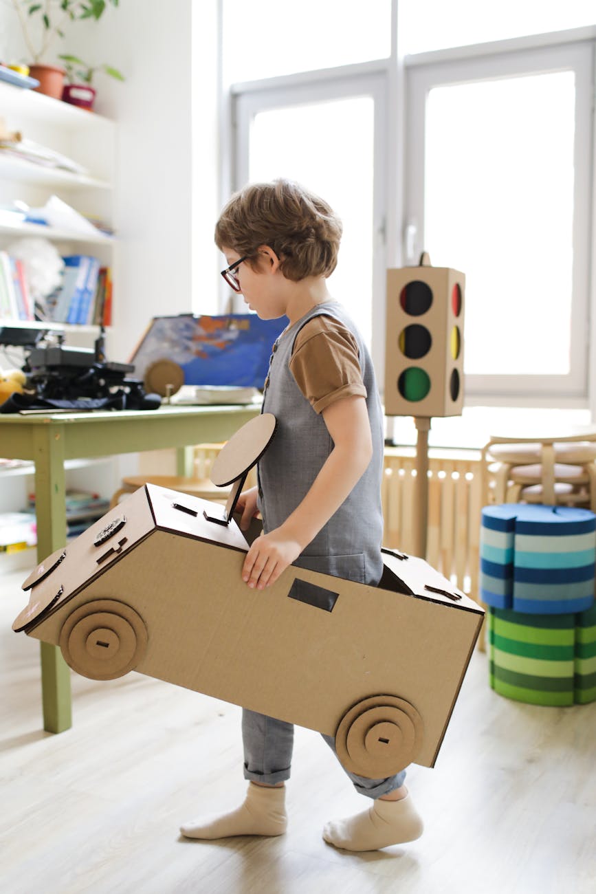 boy playing with wooden toys 12 Essential Life Skills to Teach Your Kids (Beyond School Lessons)