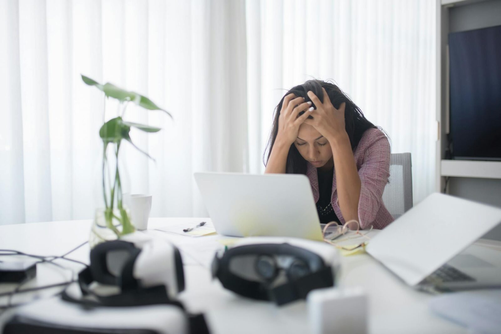 photo of a stressed woman at work